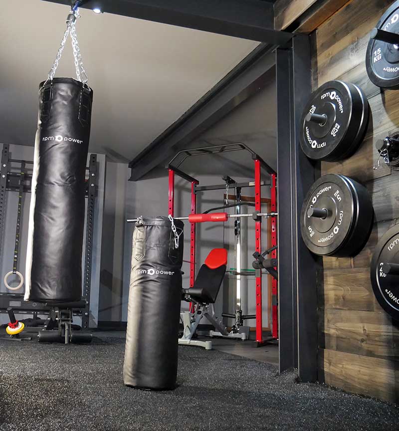 Boxing bags hanging from the ceiling of the RPM exercise equipment shop.