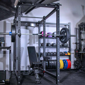 Power Rack with Storage, including a weight bench, dumbbells, kettlebell, weight plates, olympic barbell and wall balls, slam balls and medicine balls